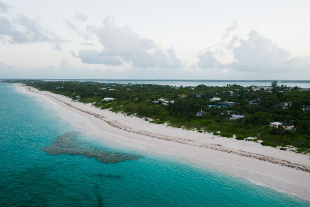 Turquoise water and white sand on a quiet Aruba winter vacation beach at golden hour